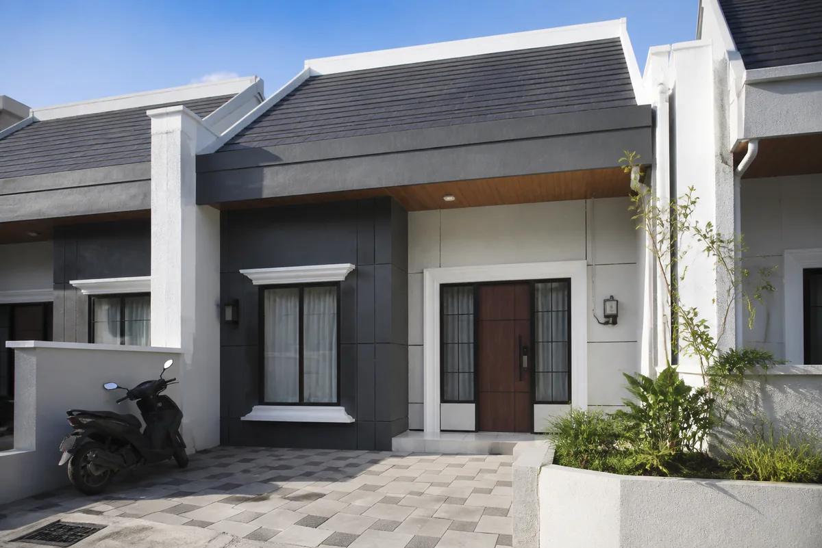 Completed Type 49 residence entrance and paved forecourt in the afternoon
