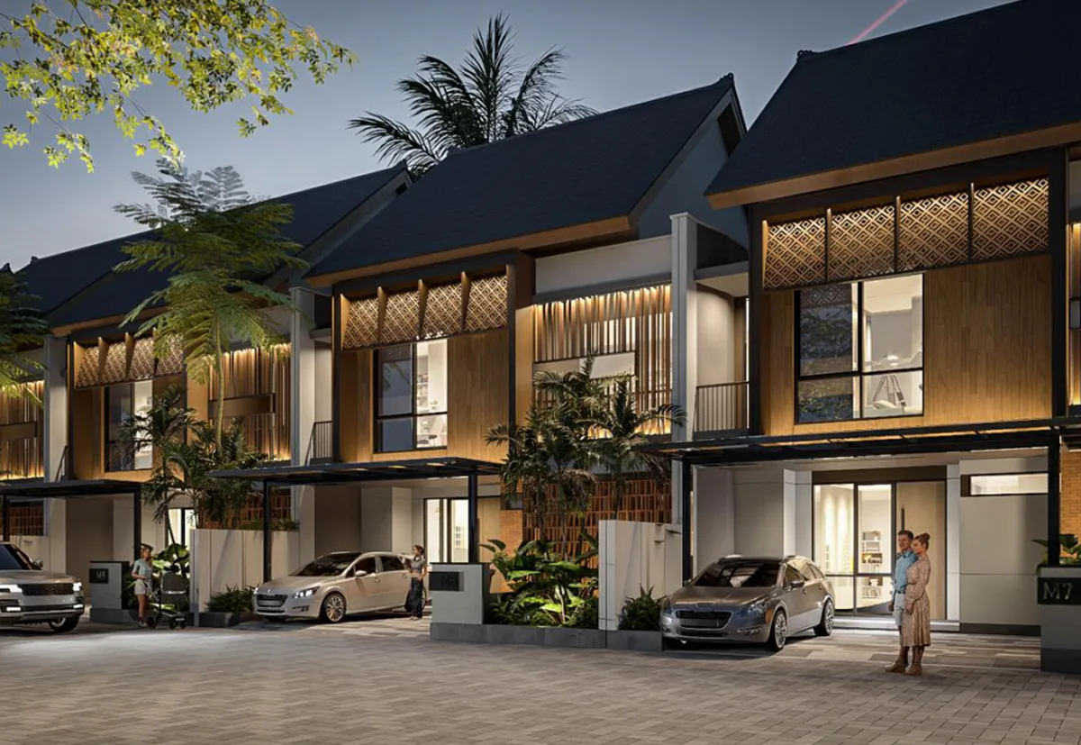 Evening street view of the Type 10 residential row with pitched roofs and patterned screens