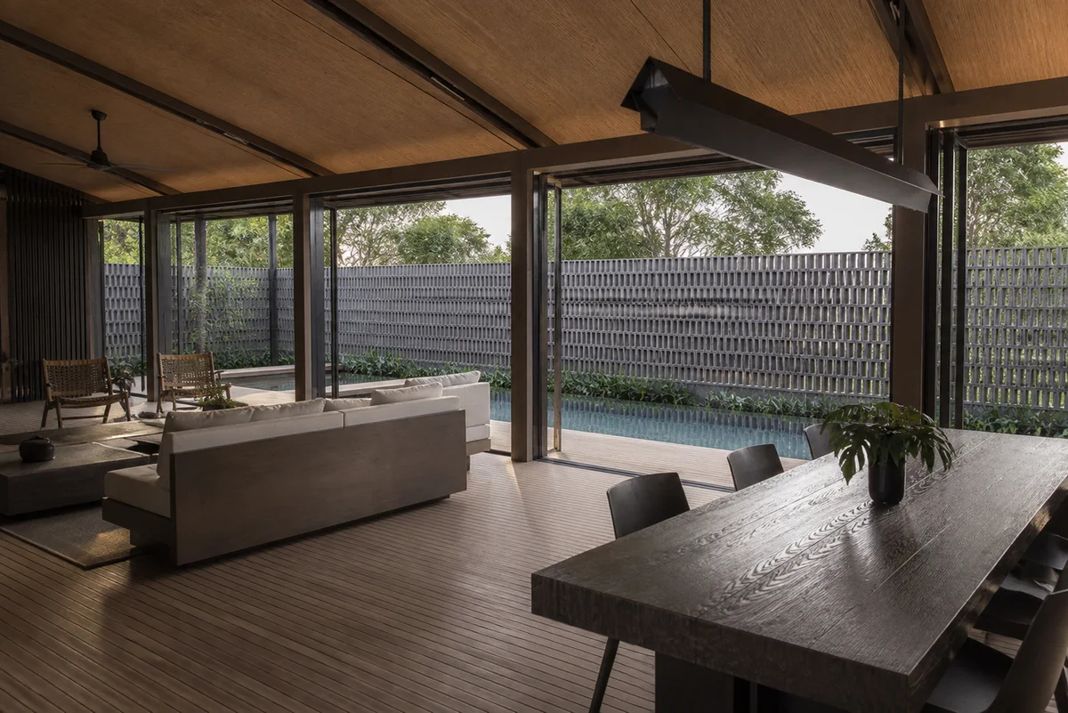 Open living and dining area connected to the private pool courtyard